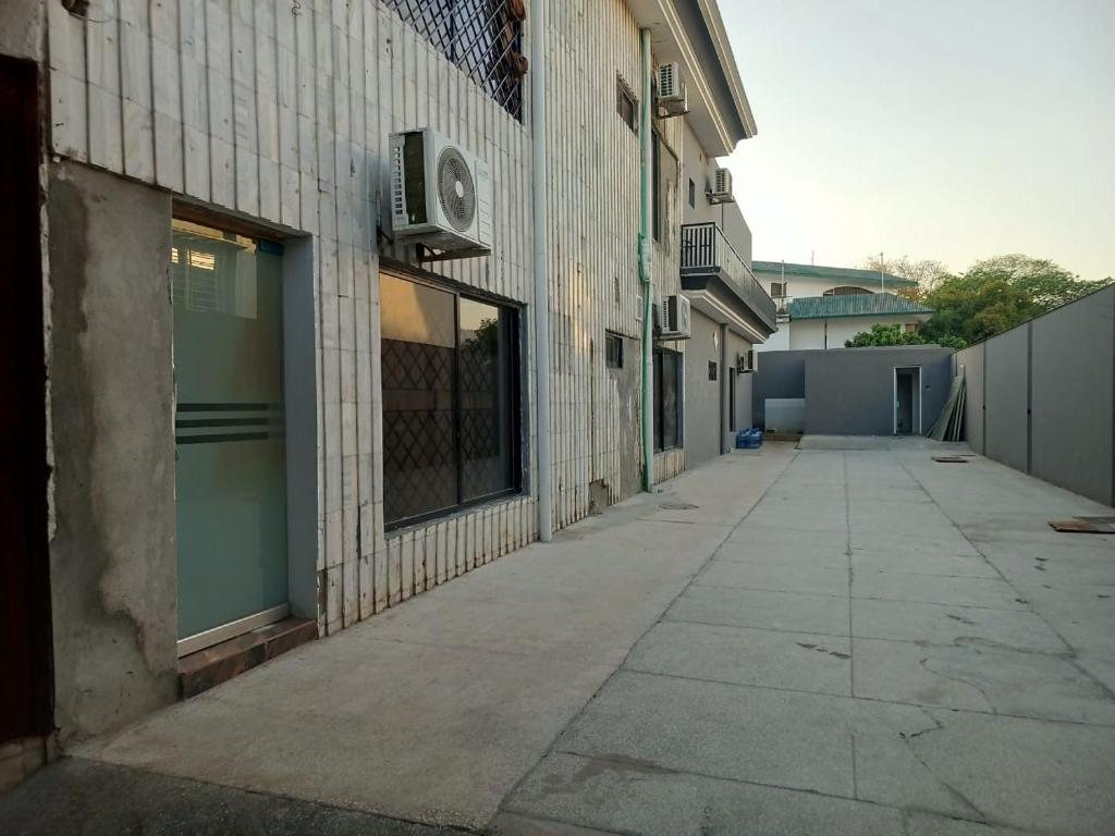 an empty sidewalk next to a building at Grandy Boutique hotel in Islamabad
