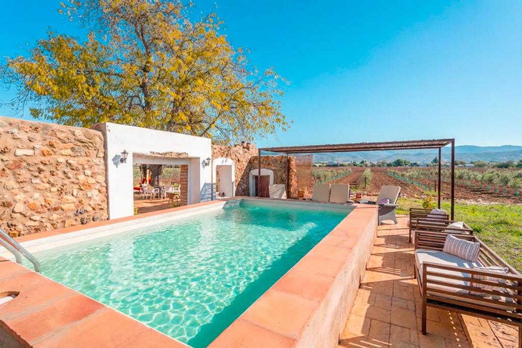 an image of a swimming pool in a villa at Cubo's Cortijo La Olivera in Antequera