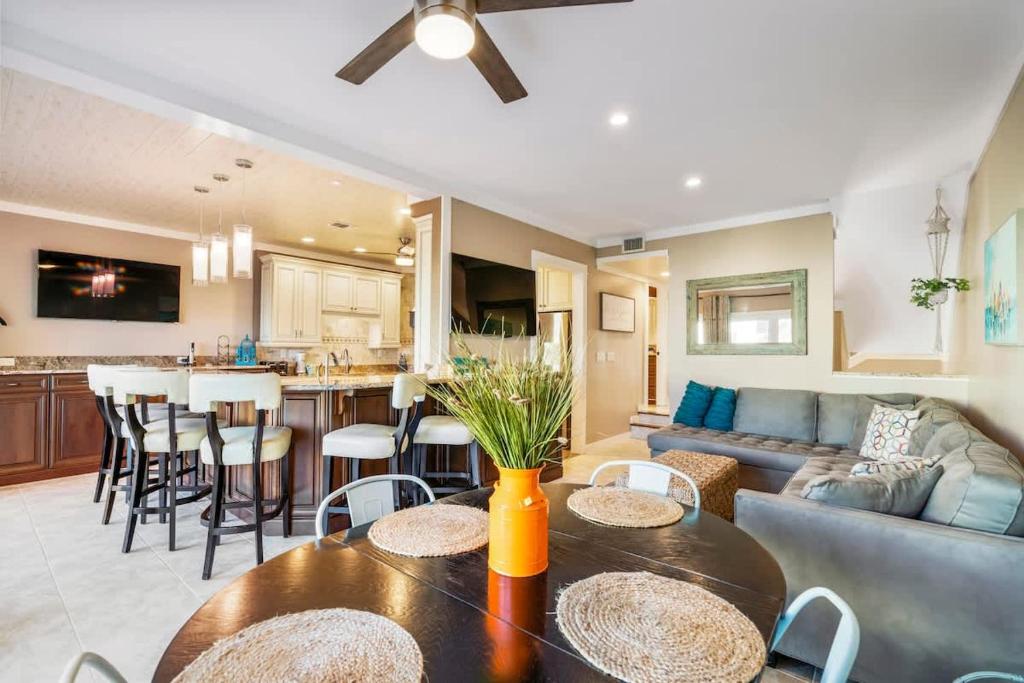a kitchen and living room with a couch and a table at Sunkissed Oasis in Navarre