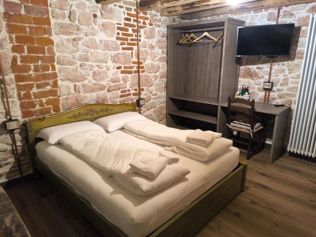 Llit o llits en una habitació de La Coccola di Camporovere