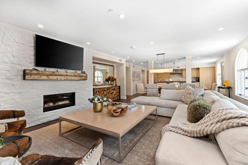a living room with a couch and a fireplace at Abode at Sky Silver in Park City