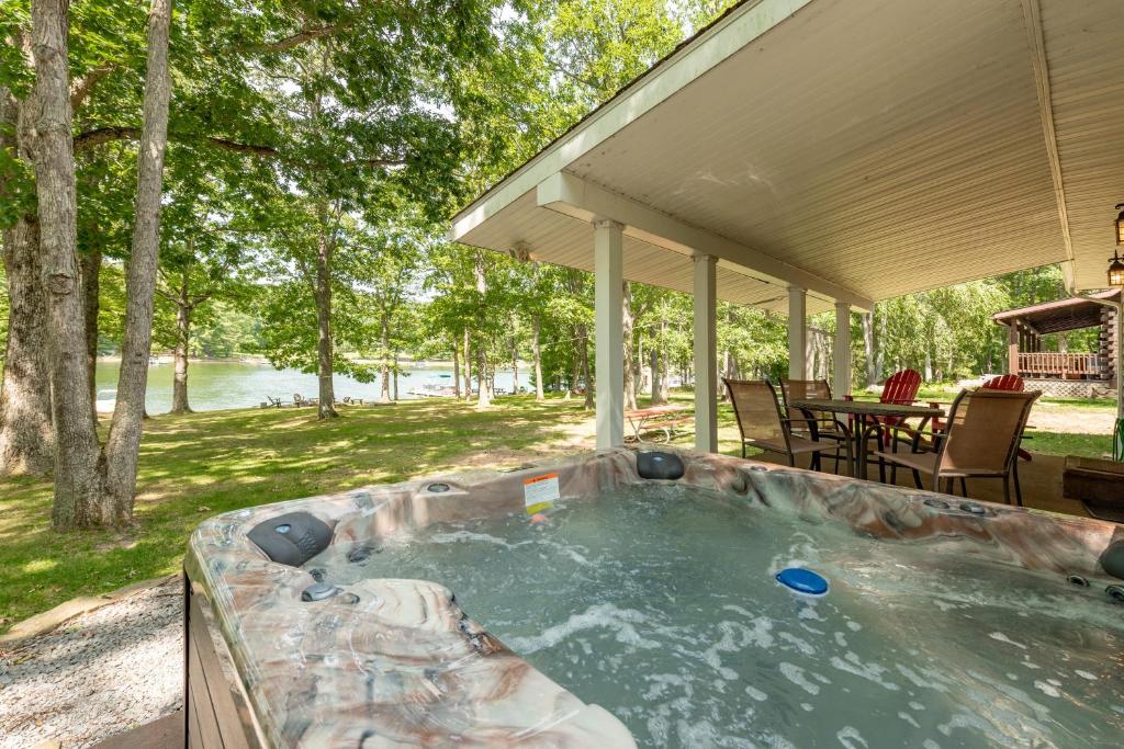 a hot tub in the backyard of a house at Smooth Sailing by Railey Vacations in Swanton