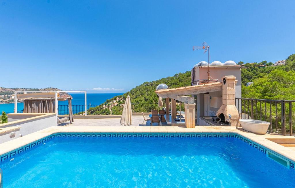 a swimming pool with a view of the ocean at Cap Vermell in Canyamel
