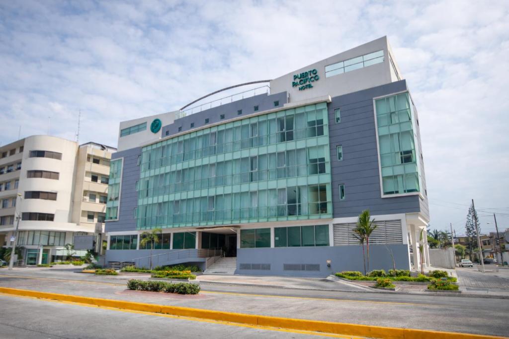 a large office building with a lot of windows at Hotel Puerto Pacifico Guayaquil Airport in Guayaquil