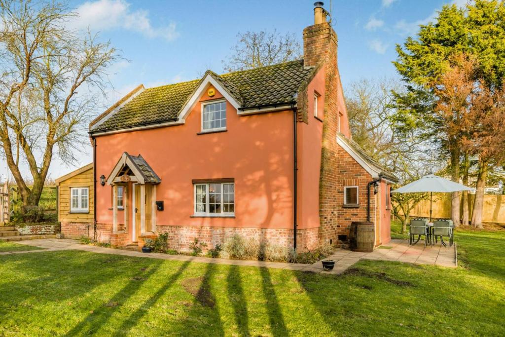 a red brick house with a grass yard at 2 Bed in Wickhampton oc-t34449 in Wickhampton
