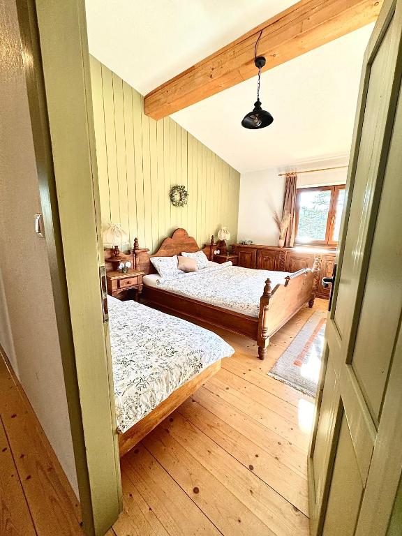 a bedroom with two beds and a window at Chata Paradise in Smižany