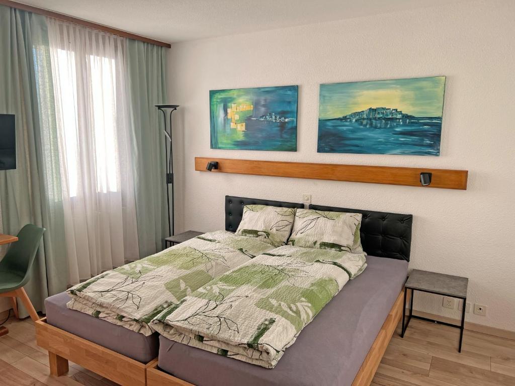 a bedroom with a bed in a room at Hotel Bellevue in Sierre