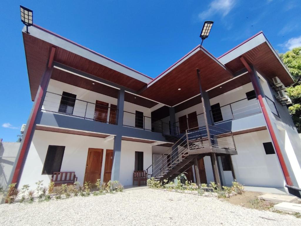 a building with a staircase in front of it at Las Morenas in Nosara