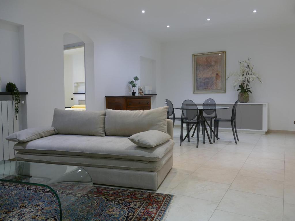 a living room with a couch and a table at Andrea Appartamenti in Savona