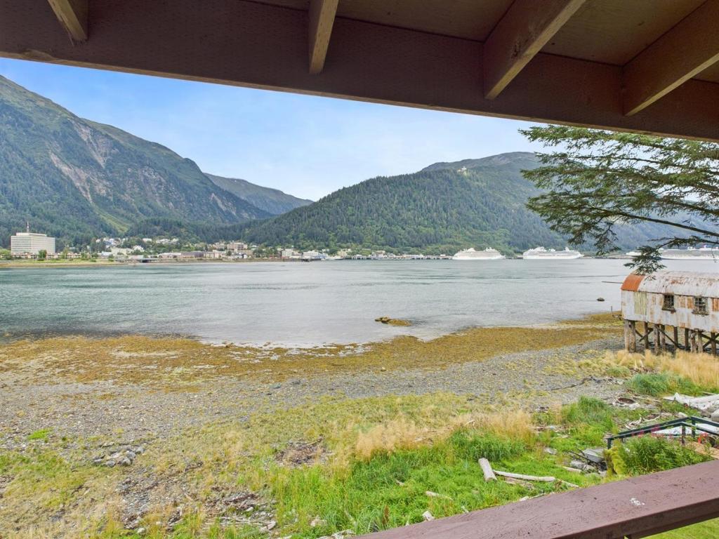 a view of a lake with mountains in the background at Oceanfront w Incredible Views in Juneau