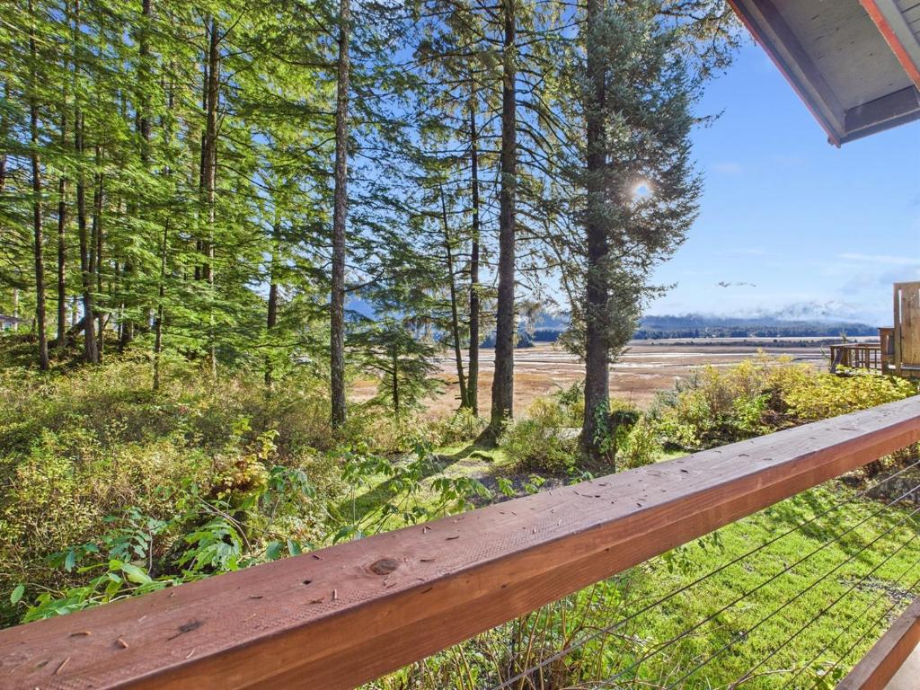 a view of a field from the porch of a house at Sunny Point 2BR with Deck & Mountain Views in Juneau