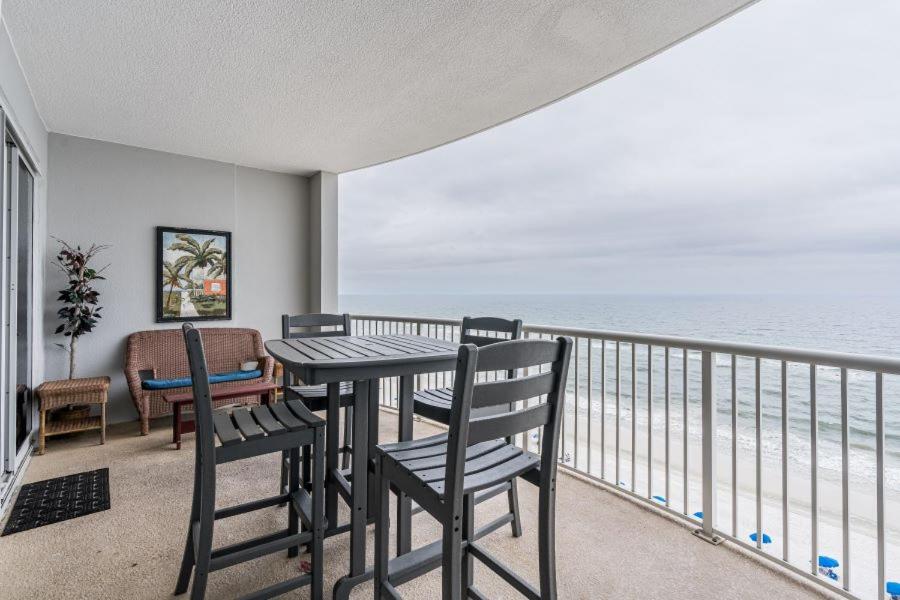 a balcony with a table and chairs and the ocean at Island Royale 1004 by Youngs Suncoast in Gulf Shores