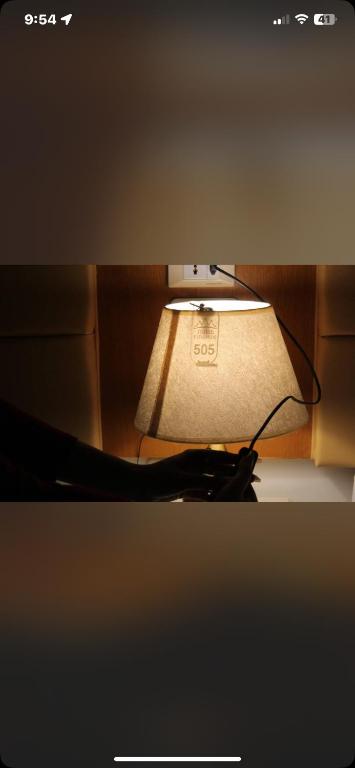 a close up of a lamp in a room at Khufu pyramids boutique hotel in ‘Ezbet `Abd el-Ḥamîd
