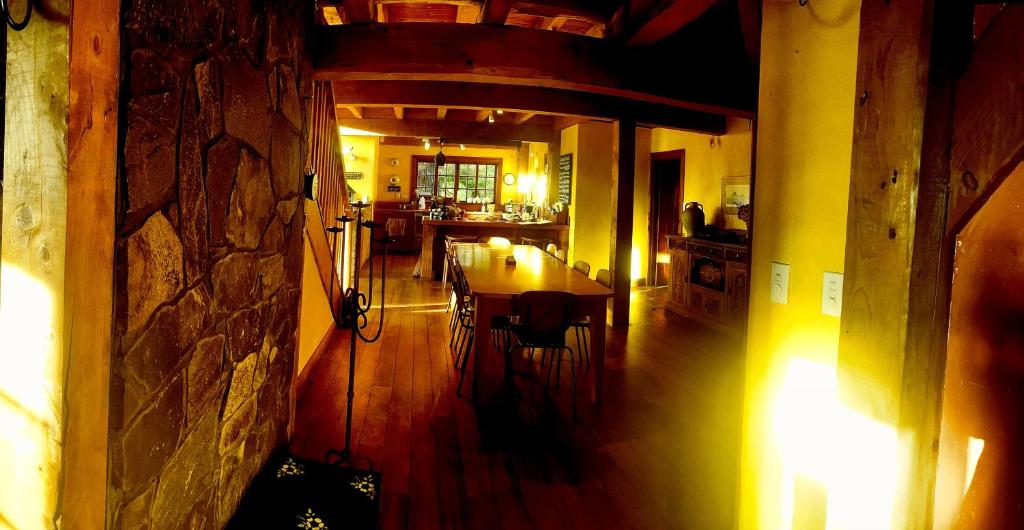 a dining room and kitchen with a table and chairs at Streamside Country Manor- Matamata in Matamata