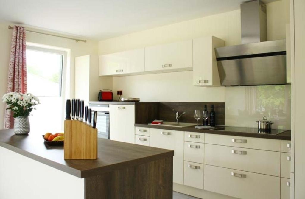 a kitchen with white cabinets and a counter top at Sonnenschein in Lenz