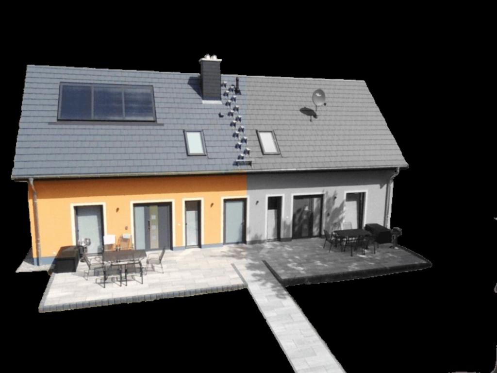 a model of a house with tables and chairs at Haus Chris in Lenz