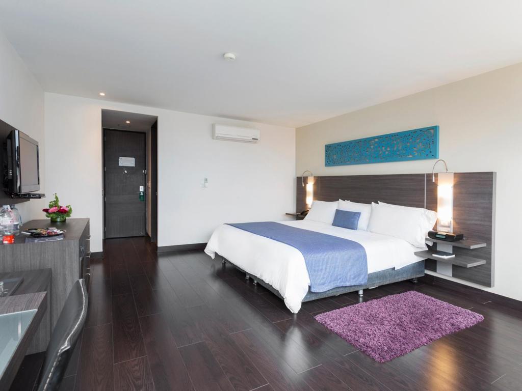 Postel nebo postele na pokoji v ubytování Hotel bh El Poblado