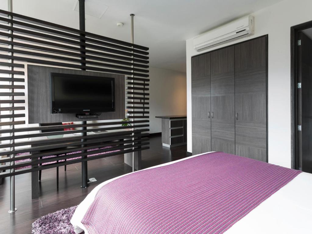 Postel nebo postele na pokoji v ubytování Hotel bh El Poblado