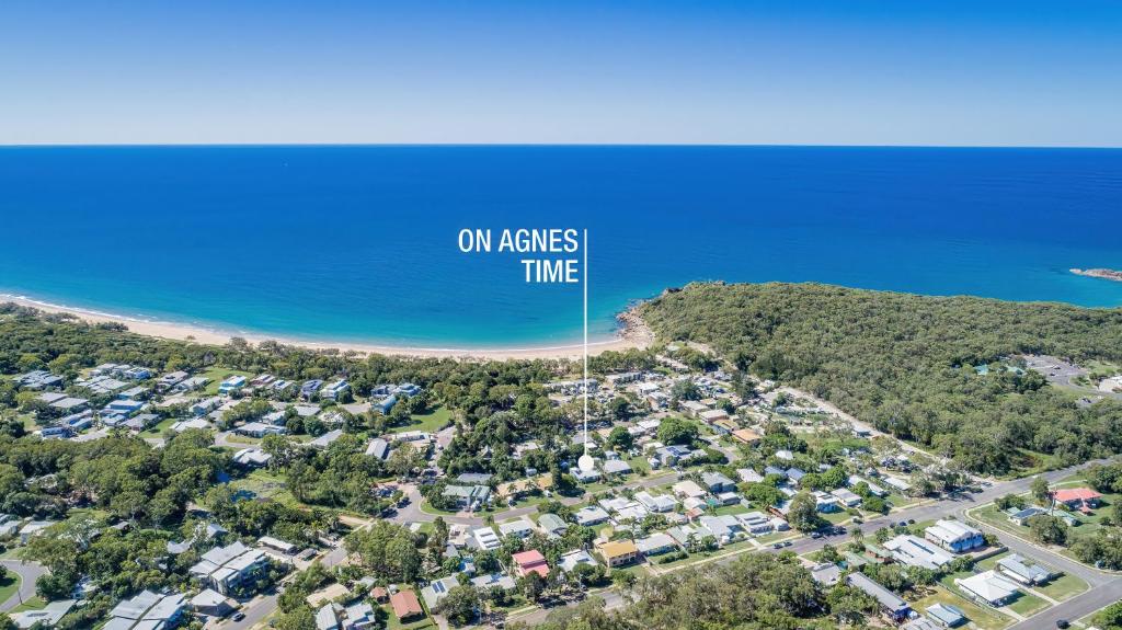 an aerial view of a beach with houses and the ocean at On Agnes Time • Beach House for 10 • BBQ Deck • Walk to Beach in Agnes Water