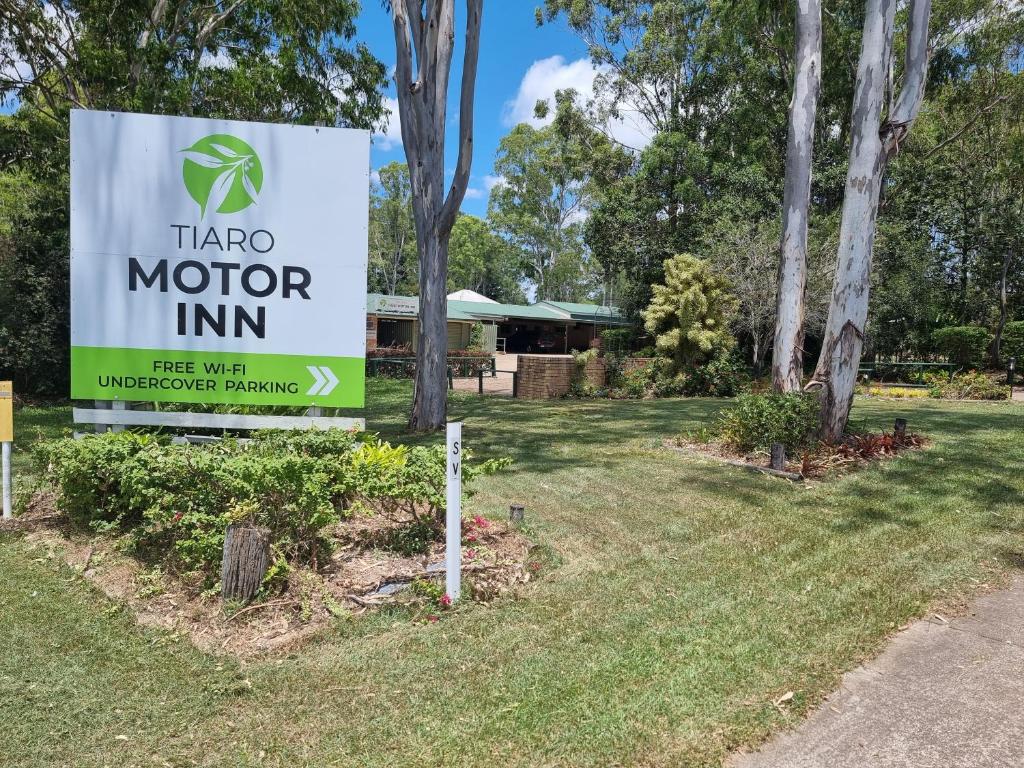 a sign for a motor inn in a park at Tiaro Motor Inn in Tiaro