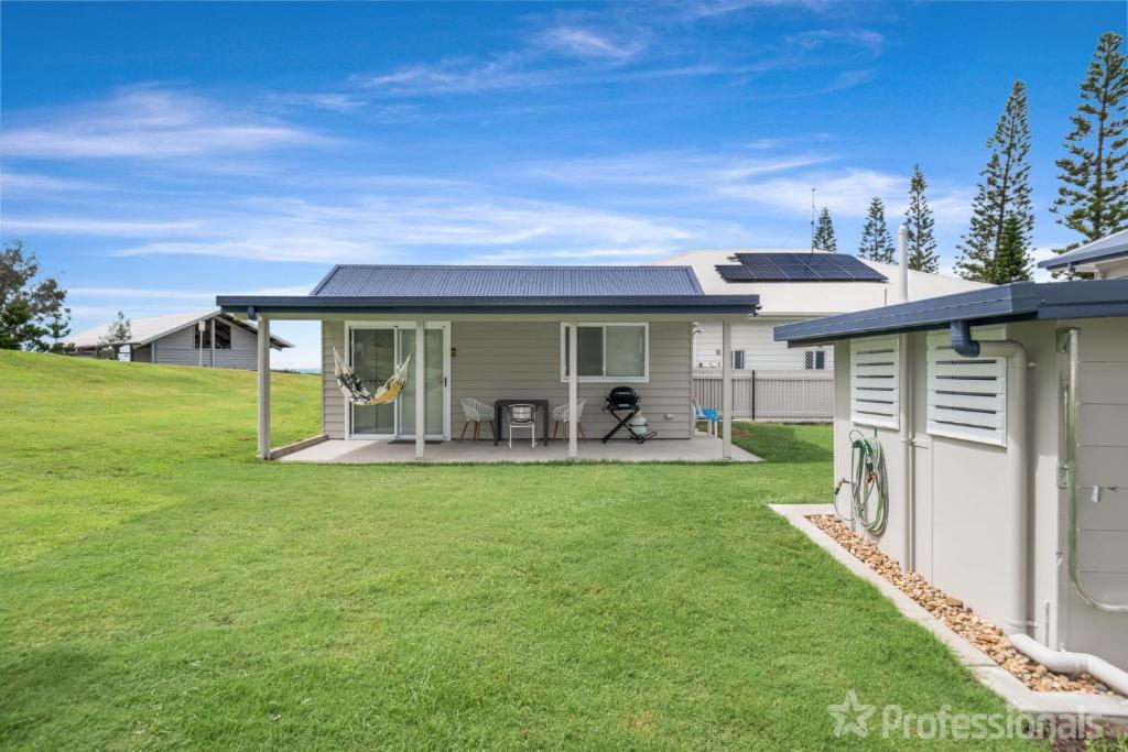 a house with a lawn in front of it at The Hideaway in Emu Park