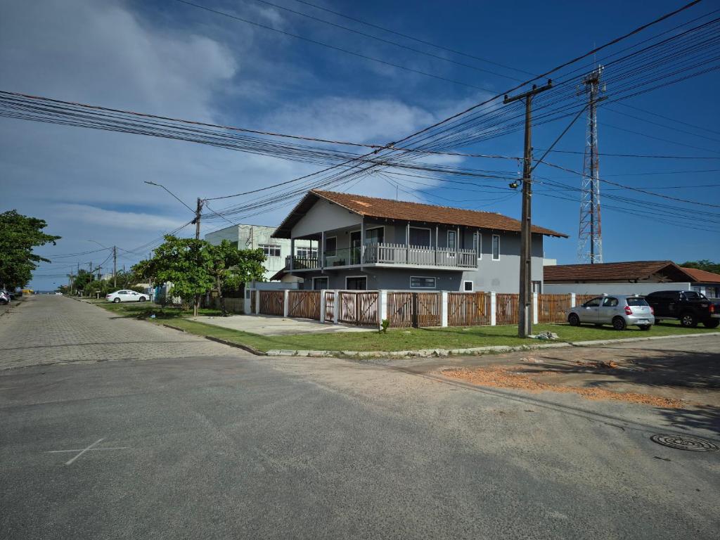 a house on the side of a street with at Quarto casal Nereidas bwc compartilhado in Guaratuba