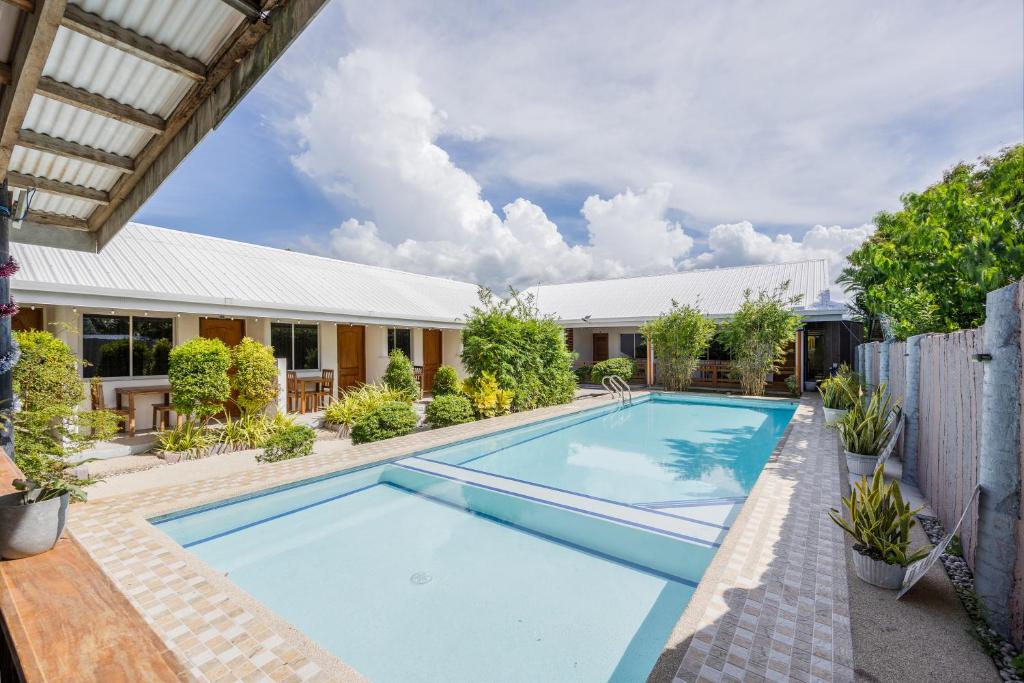 an image of a swimming pool in front of a house at Badi's Place in Moalboal