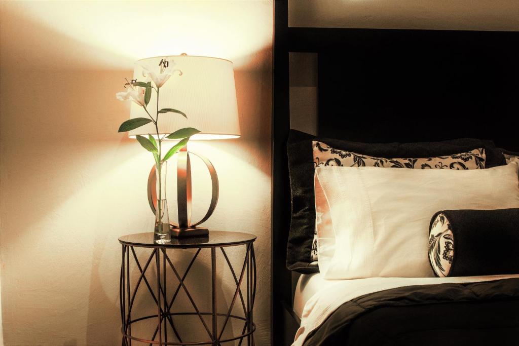 Voodi või voodid majutusasutuse La Isabela Suites toas