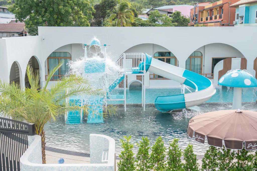 a water park with a slide in the water at De Lunar Kohlarn in Ko Larn
