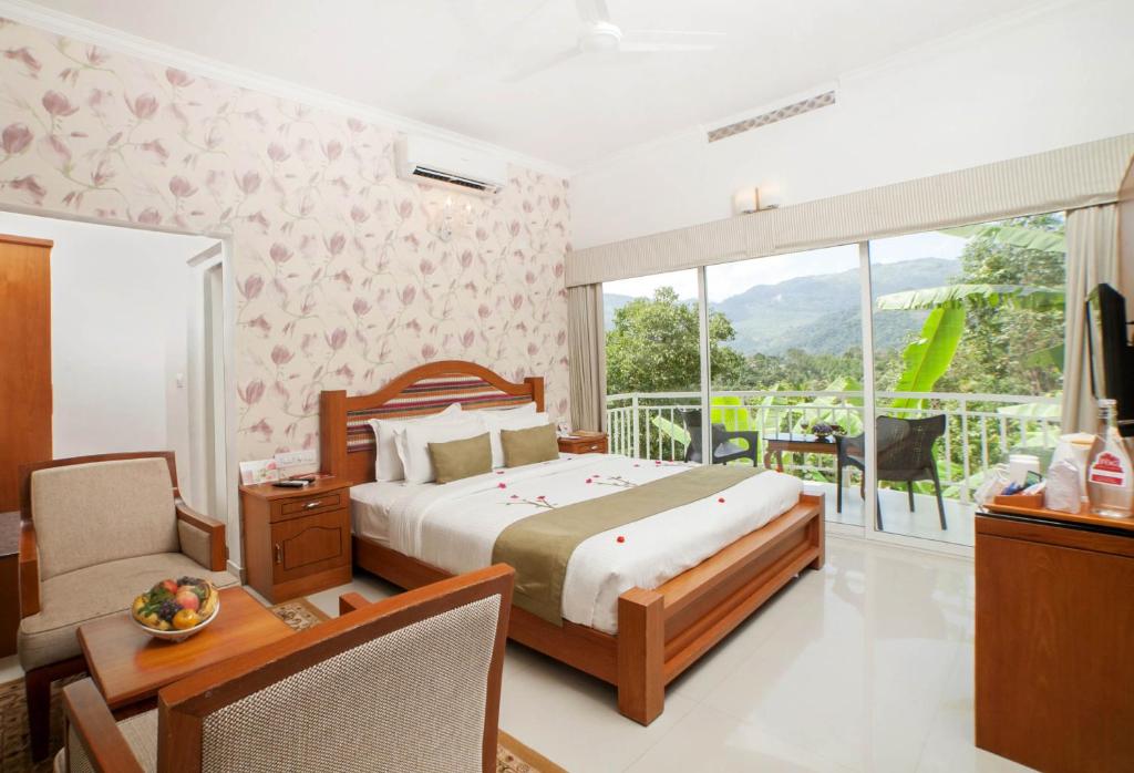 Postel nebo postele na pokoji v ubytování The Fog Munnar (Resort & Spa)