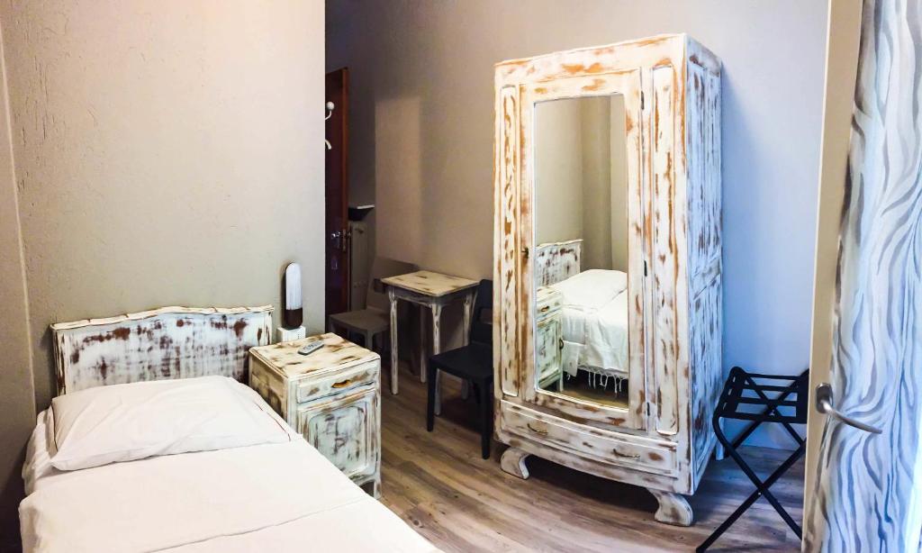 Postel nebo postele na pokoji v ubytování Albergo La Pace
