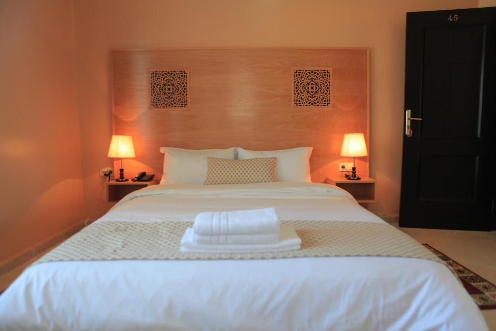 Postel nebo postele na pokoji v ubytování Hotel Miramar
