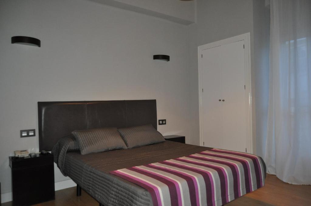 Voodi või voodid majutusasutuse Hotel Ocurris Ubrique toas
