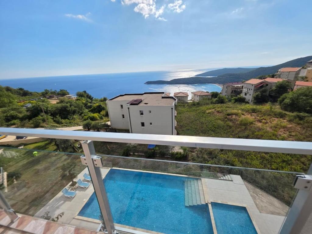 a view of the ocean from the balcony of a house at Exclusive penthouse with stunning panoramic views in Prijevor