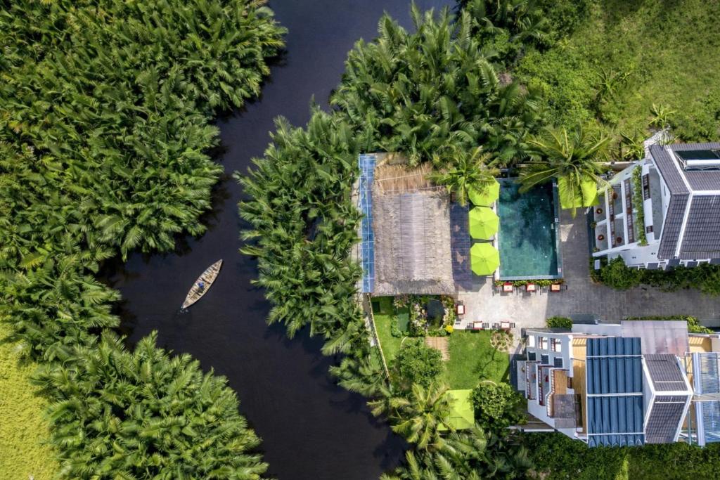 an aerial view of a house in a river at Ony Retreat Villas in Hoi An