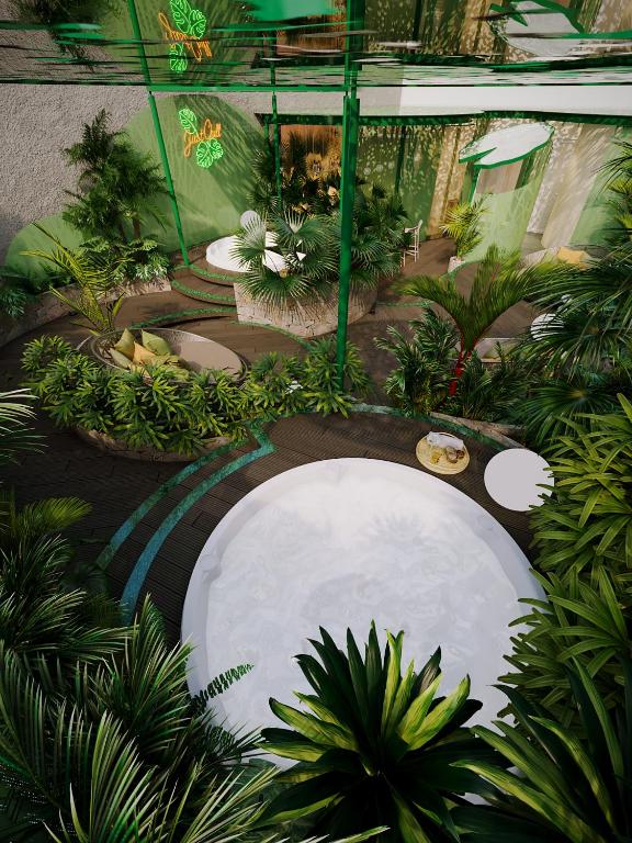 a garden with a pool of water and plants at KiN Hotel Central Park in Ho Chi Minh City