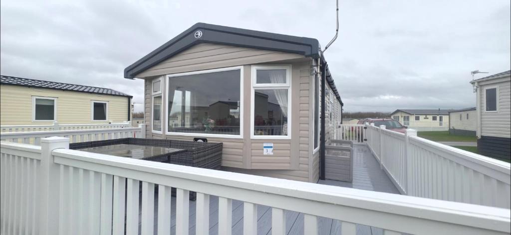 a small building on a deck on a balcony at S & S Retreat in Heysham