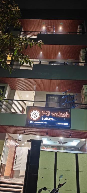 two overhead views of a psp volleyball sign in a building at Pg walaah suites in Noida
