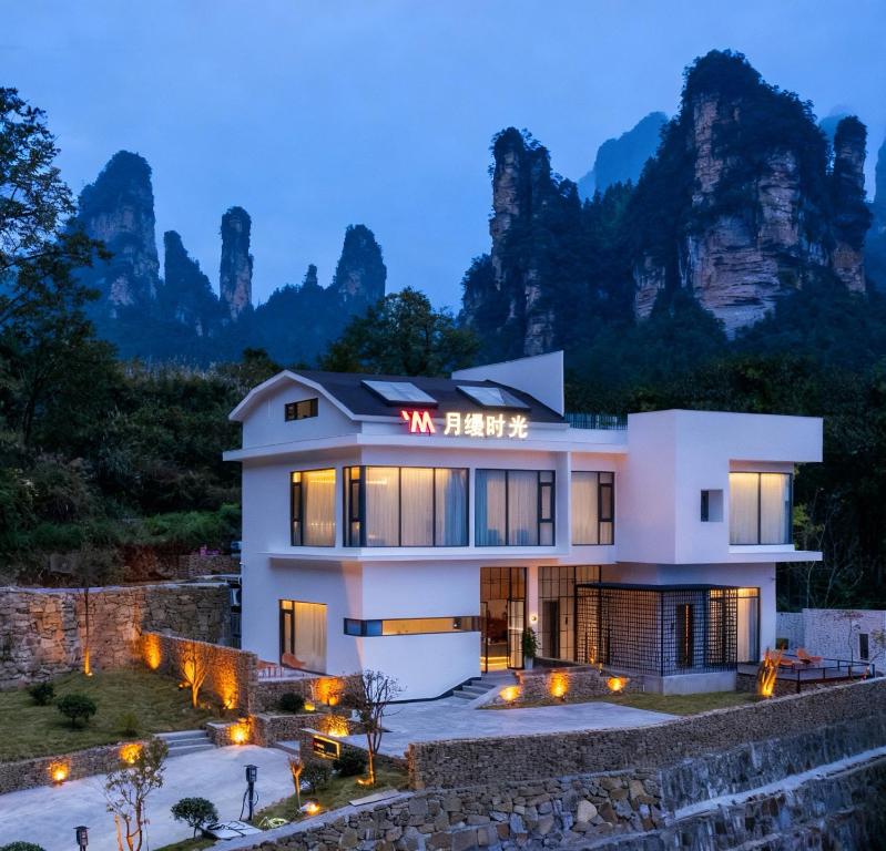 a villa with a view of the mountains at Panorama Peaks Lodge-Free pickup-Sunrise-Close to the Middle Gate Ticket Office of the Zhangjiajie Foreset Park in Zhangjiajie