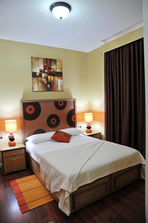 Postel nebo postele na pokoji v ubytování Culture Crossroads Inn