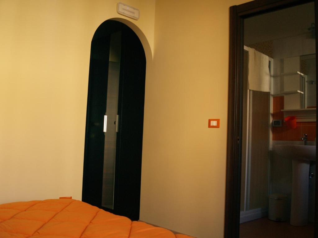 Postel nebo postele na pokoji v ubytování B&B Mamma Elena