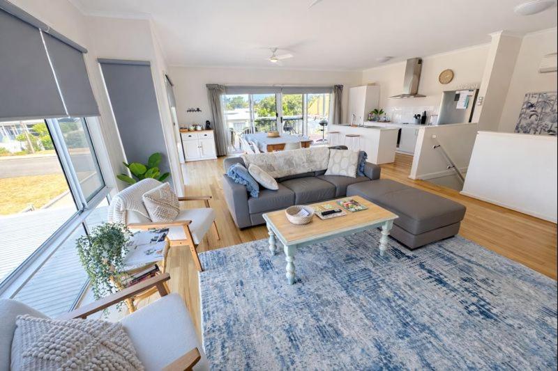 a living room with a couch and a table at Riverside Kingdom Goolwa in Goolwa