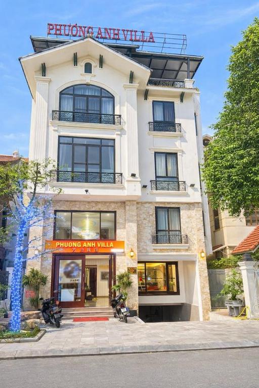 a building with two motorcycles parked in front of it at Phương Anh Villa 1 in Bắc Ninh