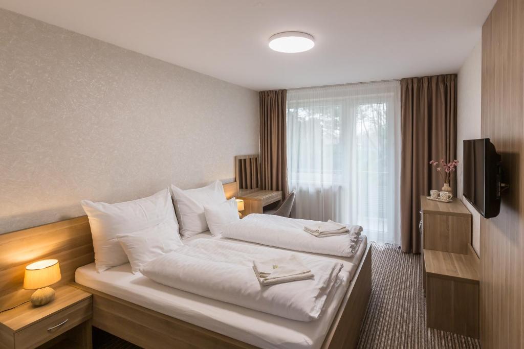 Televisor o centre d'entreteniment de Bed & Breakfast Hotel Perla