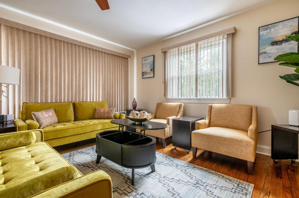 a living room with a yellow couch and chairs at 5 Woods Dr in Mechanicsburg