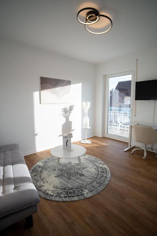 a living room with a couch and a table at JS-Business in Balingen