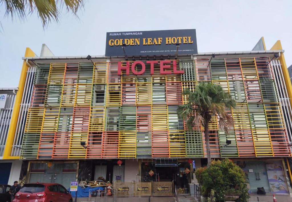 a hotel with wooden shutters on the front of it at Golden Leaf Boutique Hotel Nusa Idaman Branch in Johor Bahru