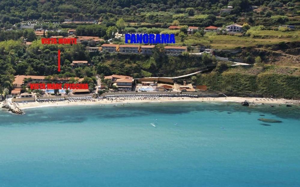 an aerial view of a beach with a resort at Baia Tropea in Fitili