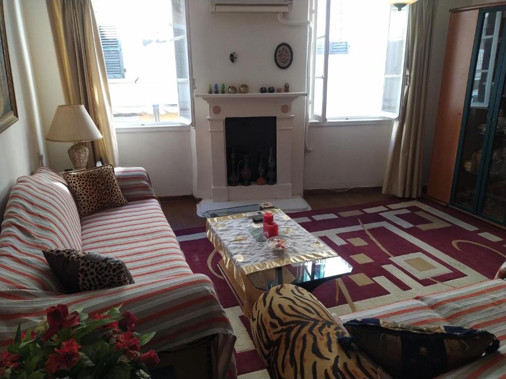 a living room with a couch and a coffee table at Spiros old town apartment in Corfu