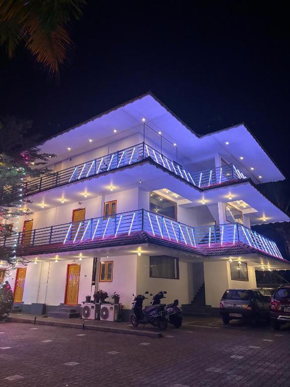 a building with two motorcycles parked in front of it at MJ paddy view Homestay in Kumarakom